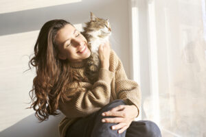 pets-are-good-for-your-health-woman-and-cat-in-sunshine.jpg 