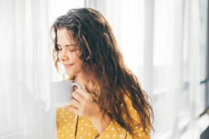 Woman drinking her morning coffee